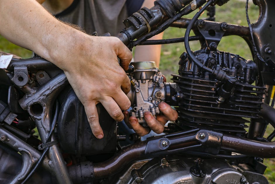 Illustration of a mechanic repairing a motorcycle carburetor